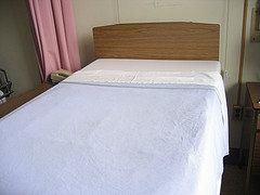 Hospital beds are bland, BYO cheerful rug.